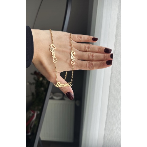 Çelik kalp detaylı isimli üç isimli kolye